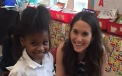 Jessica Gregory is volunteering her time reading with first grade students at Roosevelt Elementary School